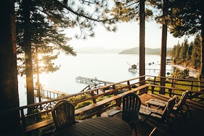 Watch the sunrise from over the mountain tops of the North side of the lake