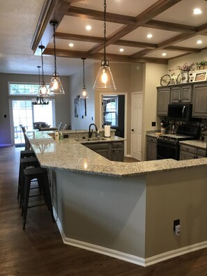 The kitchen opens into a dining area that seats six.