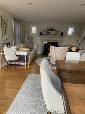 Looking into living room from dining area; seats 6-8