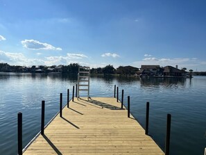 Extended dock with ladder.  The downstairs dock is the place to be for happy hour with its easy access to the kitchen and to the wonderful lake water.