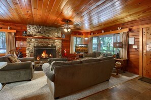 Living room with a beautiful rock fireplace