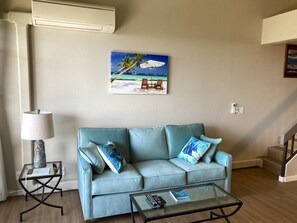 Living Room with Queen Sofa Sleeper and Air Conditioner
