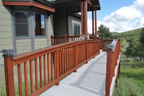 Wood Bridge to Front Entrance and Mountain Views