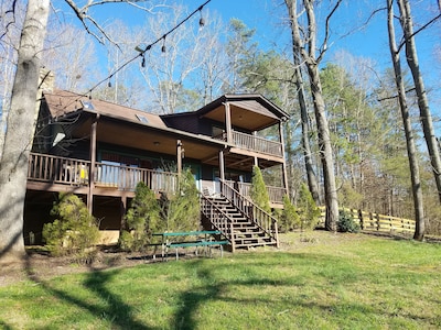 spacious log cabin on 3+ acres with river access on property
