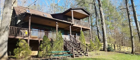 spacious log cabin on 3+ acres with river access on property
