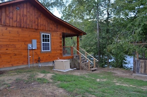 Side of Cabin where gas grill is