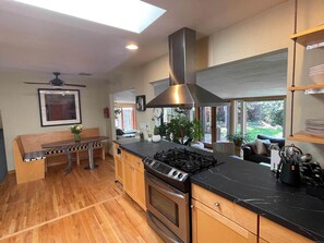 Large spacious kitchen, great natural light, opens to dining room & kitchenette
