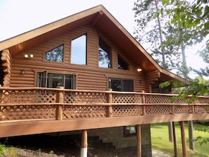 Main cabin deck with lake views, new propane grill, and a screened-in porch