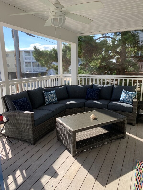 Screened in porch with ceiling fan and very comfortable sofa.