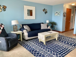 Family room, couch opens to a sleeper sofa. 