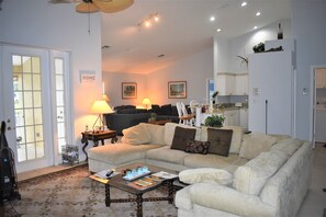 Living Room with Kitchen and Sitting Area. Lanai to left, front door to right