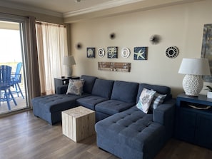 A newer large sectional couch in the living room provides comfortable seating for everyone!