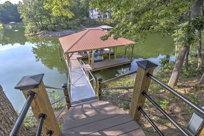 Dock with 21ft depth of water. Electric at shore for all your needs. 