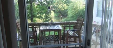 Looking out back of condo on to the deck & patio overlooking pond, very peaceful