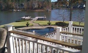 View from the kitchen balcony with staircases going down to the Lake and Pool. 