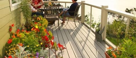 Marion's flowers and herbs brighten the morning light on our deck