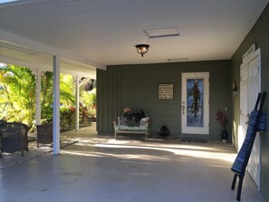 Covered carport with beach closet











