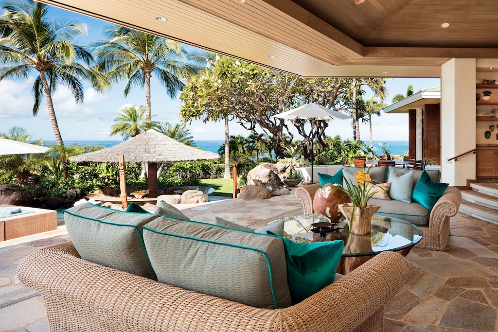 Inviting couches on the Lanai of this vacation rental in Hawaii