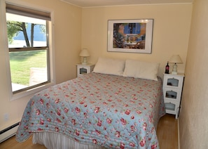 Enjoy views of the river from the front bedroom with a queen size bed