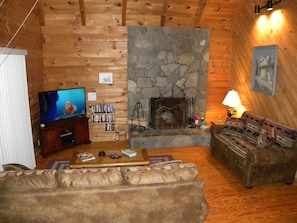 Main floor living area with wood burning fireplace