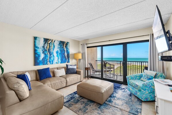 The Living Room Features A Large Comfortable Sectional