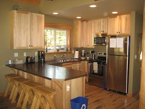 Fully equipped kitchen with bar seating for 4.