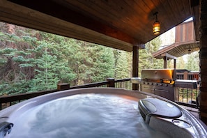 Soak in the very private hot tub all year round