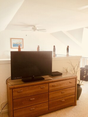 TV in bedroom upstairs by loft. Bedroom is semi private from loft area.