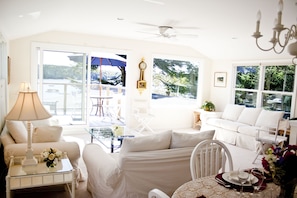 Upstairs living and dining room with deck overlooking harbor.