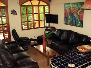 Beach house living room with surround sound and flat screen TV