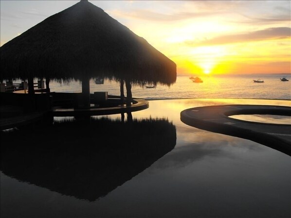 Sunrise through Palapa from My Condo