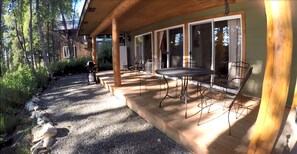 Custom covered deck with patio and grill over looking the Kasilof River