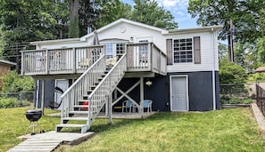 Back side showing stairs to upper rental space and grill location.