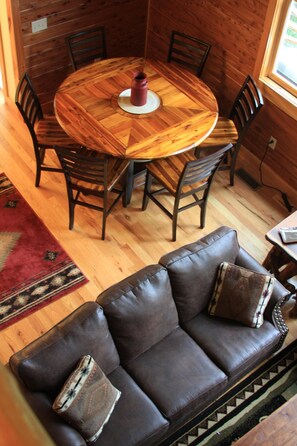 Additional dining...circular natural wood table with up to 8 chairs available.