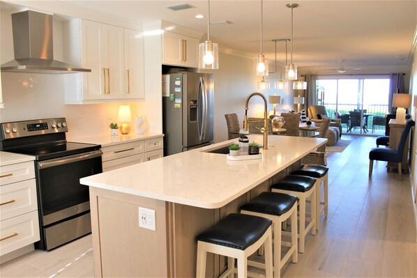 New kitchen with extra seating, lots of light and space to create great dinners!