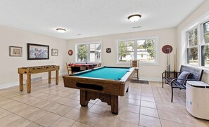 Pool, foosball, & air hockey tables to entertain you in the rec room