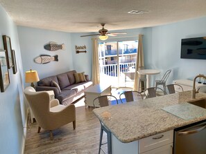 Comfortable living room with memory foam sofa sleeper,  cable TV, and smart TV