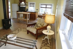 Main living area including gas-fired heating stove.