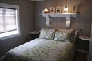 Bedroom/queen size bed, lots of pillows/quality bedding/personalized lighting.