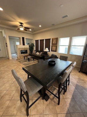 View from Kitchen to Family Room.  Large dining table that seats 6.