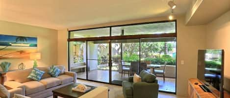 Main living room with view of pool