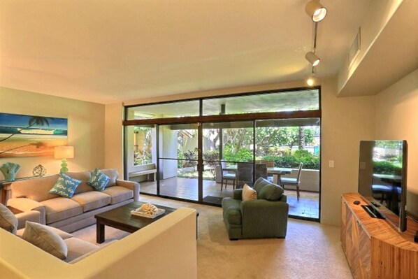 Main living room with view of pool