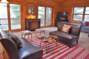 Upper Family Room with walk out to deck and lake views.