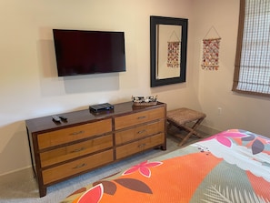 Smart tv, plenty of drawer space, & a walk-in closet too!