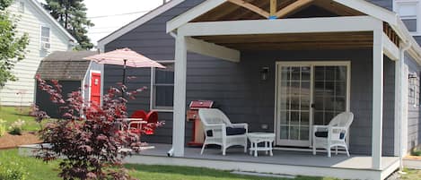 The deck seating and dining areas, and the toy shed.