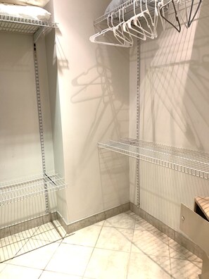 Spacious walk-in closet with locking safe