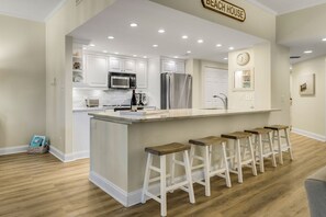 Spacious remodeled kitchen overlooks living room