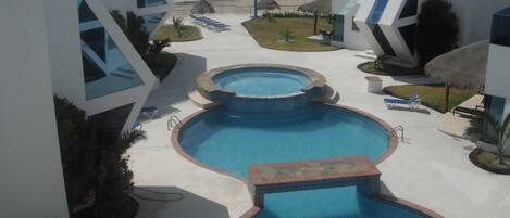 Balcony View overlooking swim pool and beach