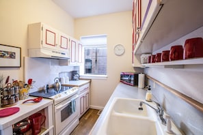 Bright, stocked Kitchen makes cooking easy.