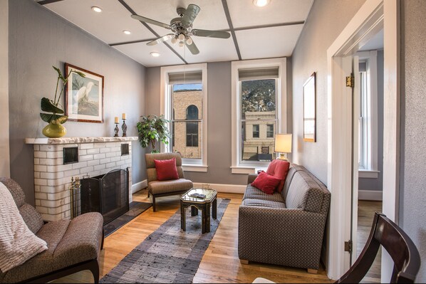 Comfortable, Bright, Cozy living room with working fireplace.